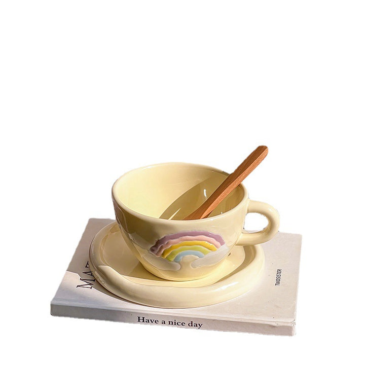 Stoneware breakfast mug with saucer and embossed rainbow design