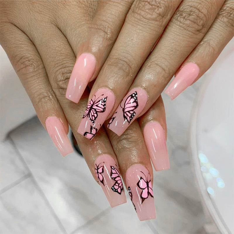 Artful acrylic nails with dynamic butterfly design Kalsten