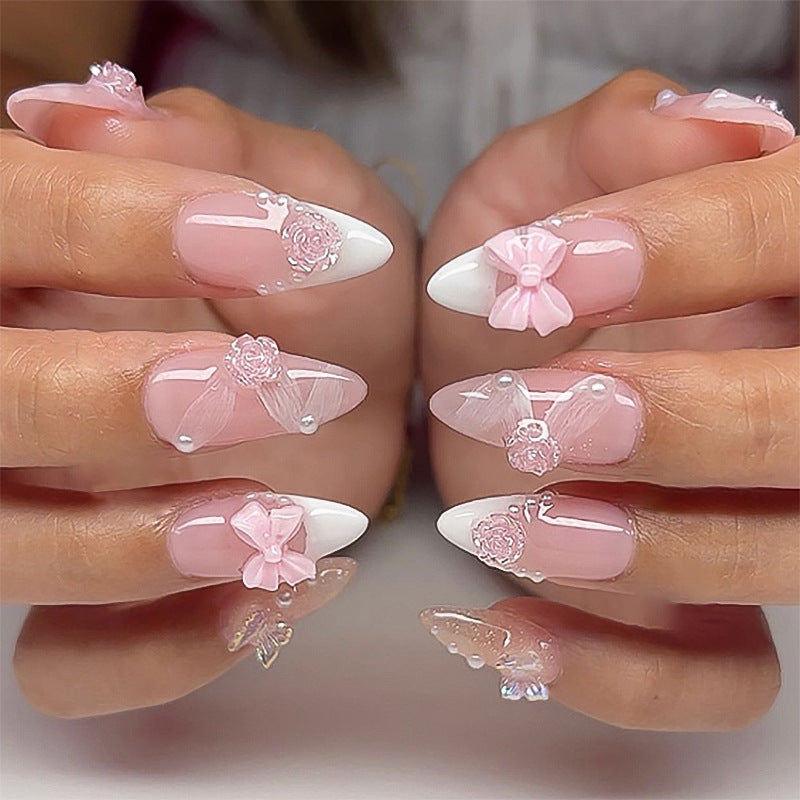 Artistic nail extensions with floral decorations and glitter accents Kalsten