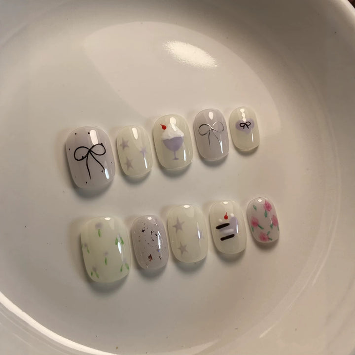 Artistic Press-On Nail Art Set with Cute Cake and Ribbon Designs