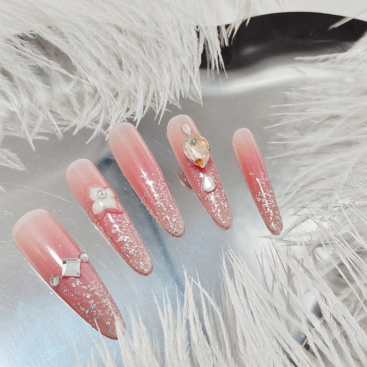 Artificial nail set with glitter and flower accents Kalsten