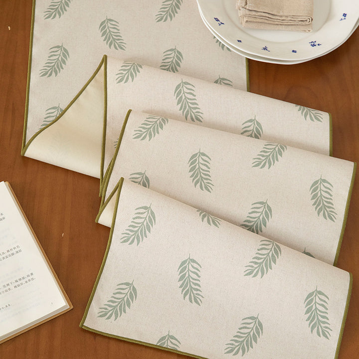 Woven table runner and placemat set made of cotton-linen with botanical scrolling pattern