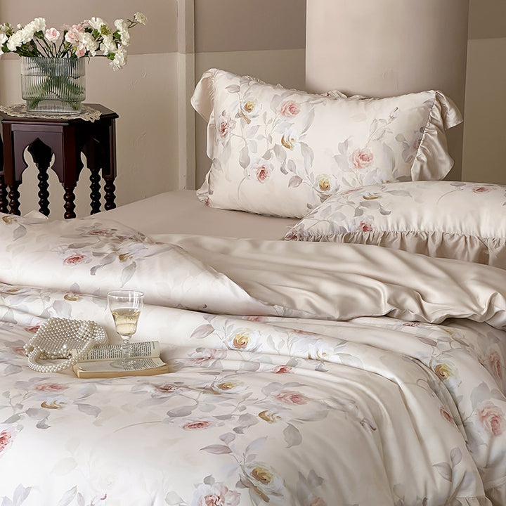 Luxurious satin bedding set with ruffled pillows and delicate watercolor rose print