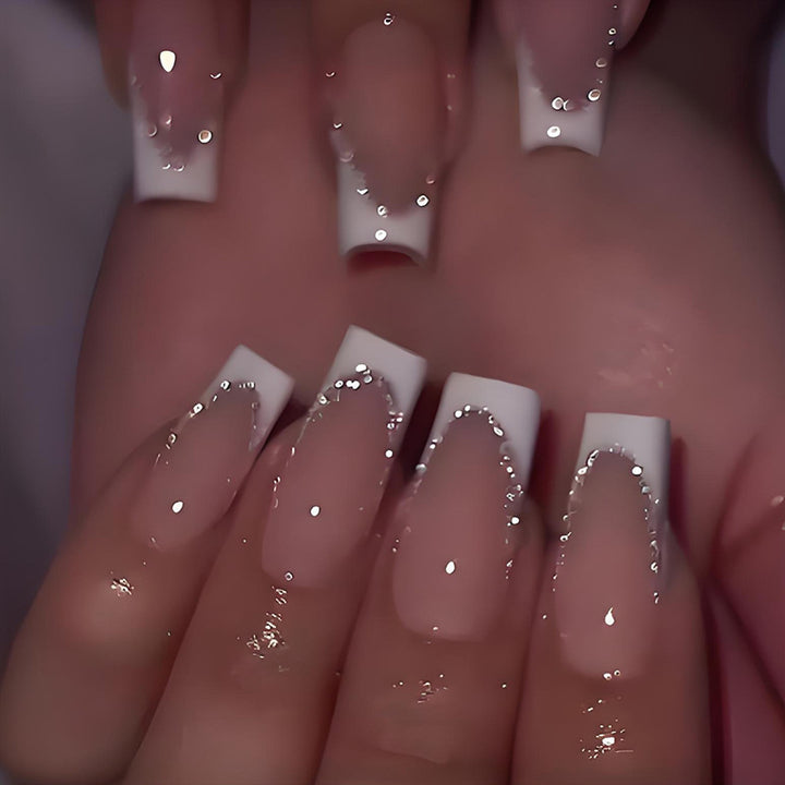 Artificial nail set with elegant French tip and glitter accents Kalsten