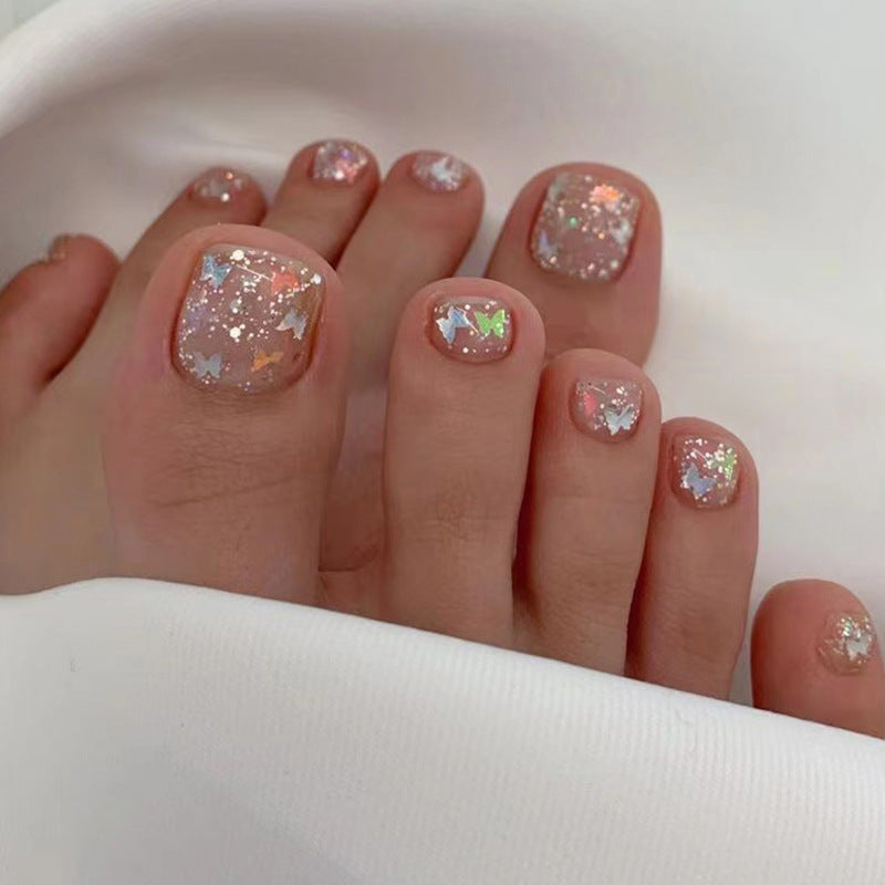 Artful toenail art with glitter and butterfly designs Kalsten