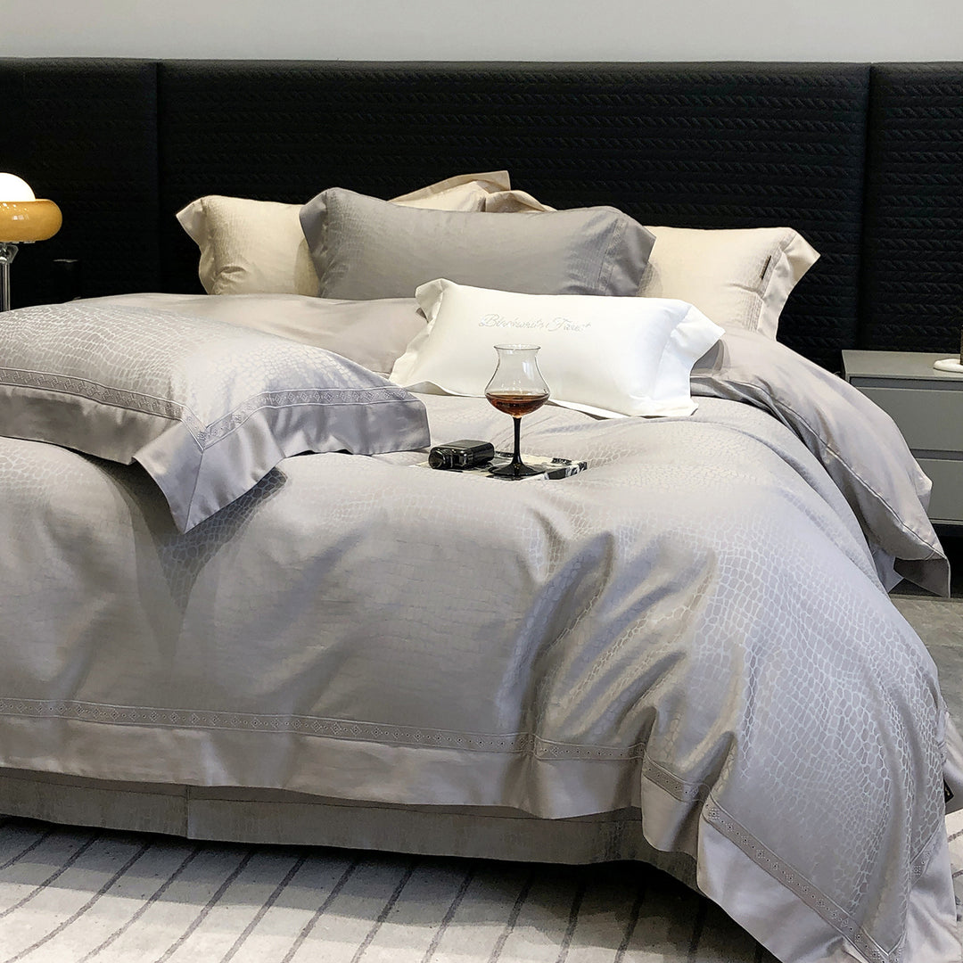 Premium cotton satin bedding set with structured matelassé border and hotel closure