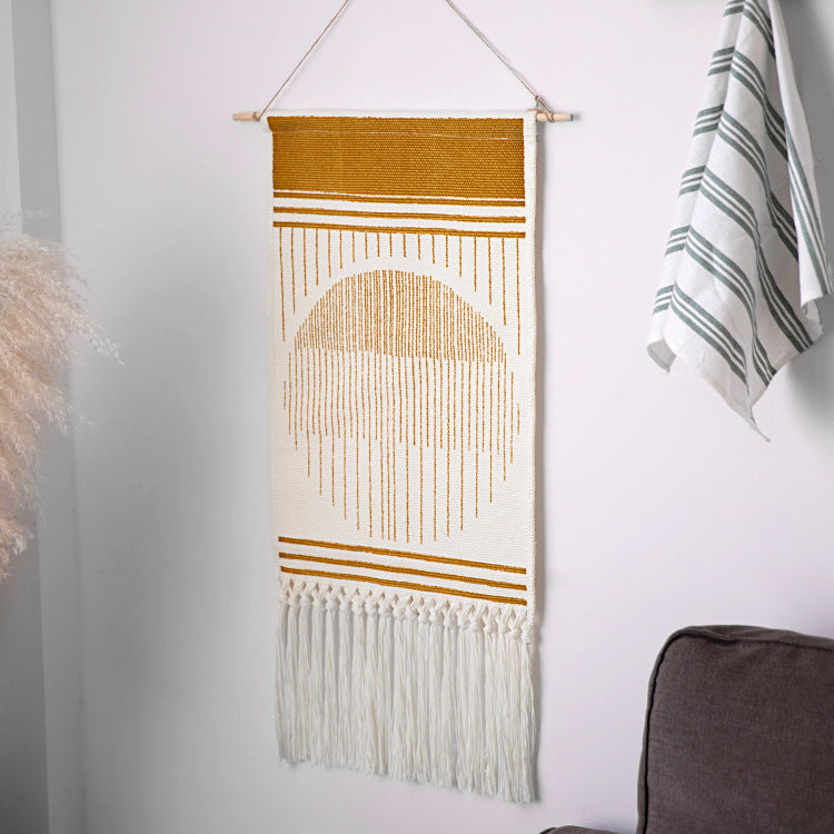 Handcrafted cotton tapestry wall decoration with macrame fringes and geometric circle motif