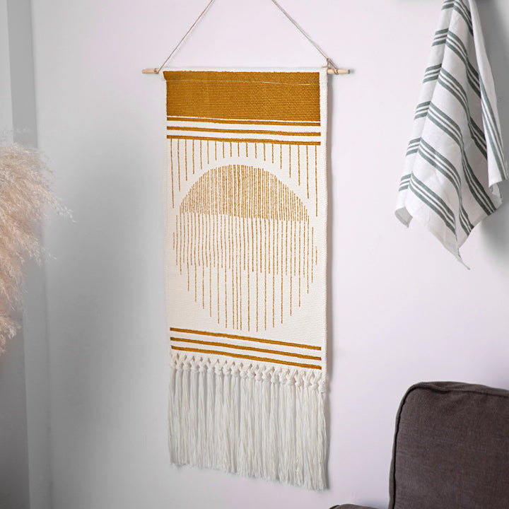 Handcrafted cotton tapestry wall decoration with macrame fringes and geometric circle motif