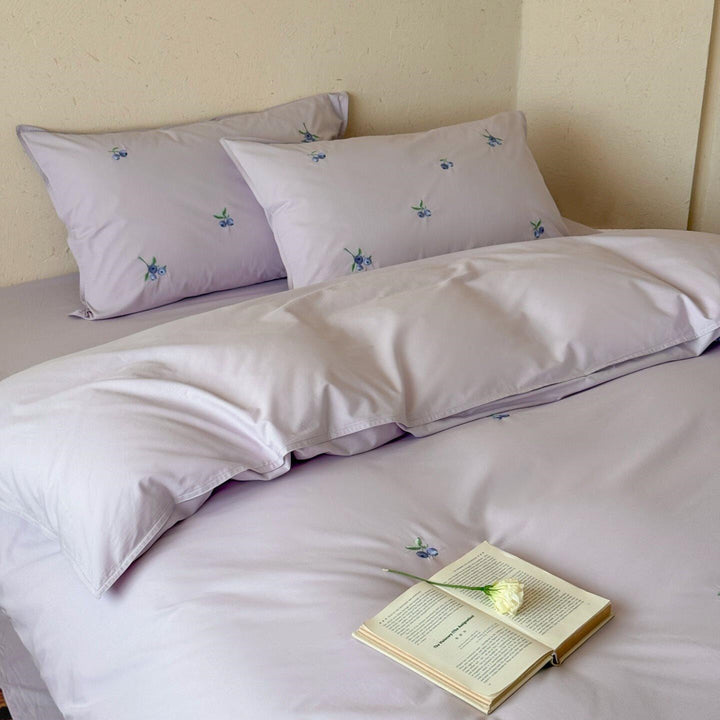 Luxurious cotton satin bedding set with delicate berry embroidery and silky-matte finish