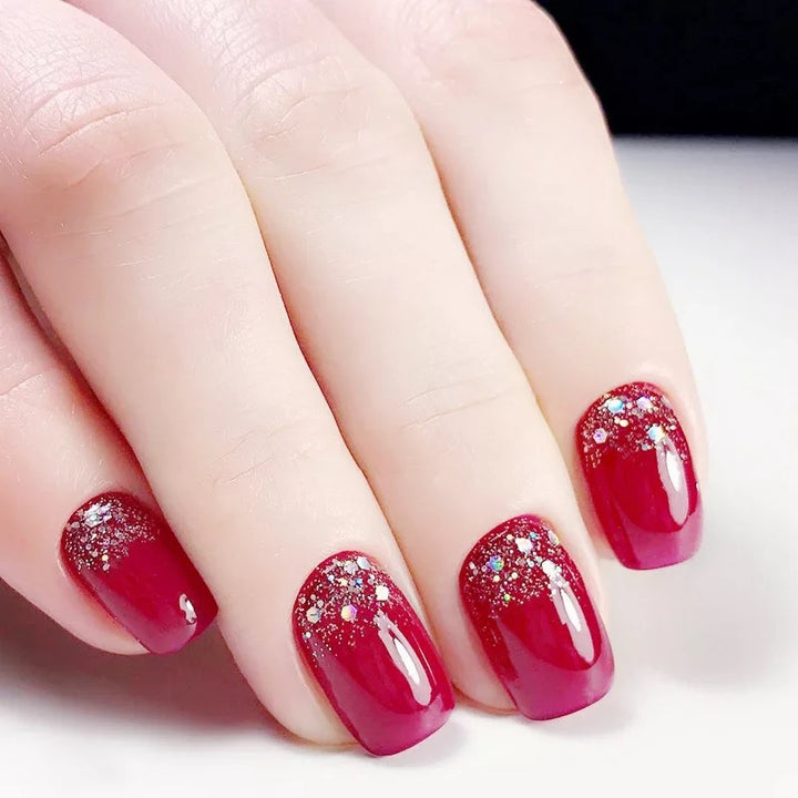 Glamorous artificial nails with glitter accents Kalsten
