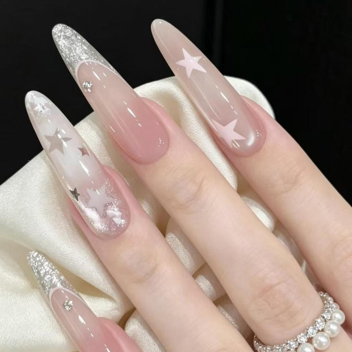 Stiletto Nail Enhancements with Glitter and Star Accents