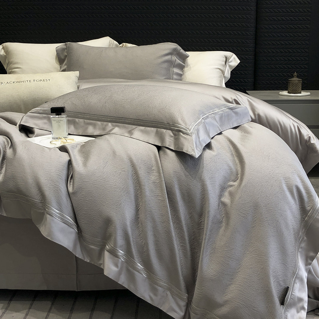 Premium cotton satin bedding set with structured matelassé border and hotel closure