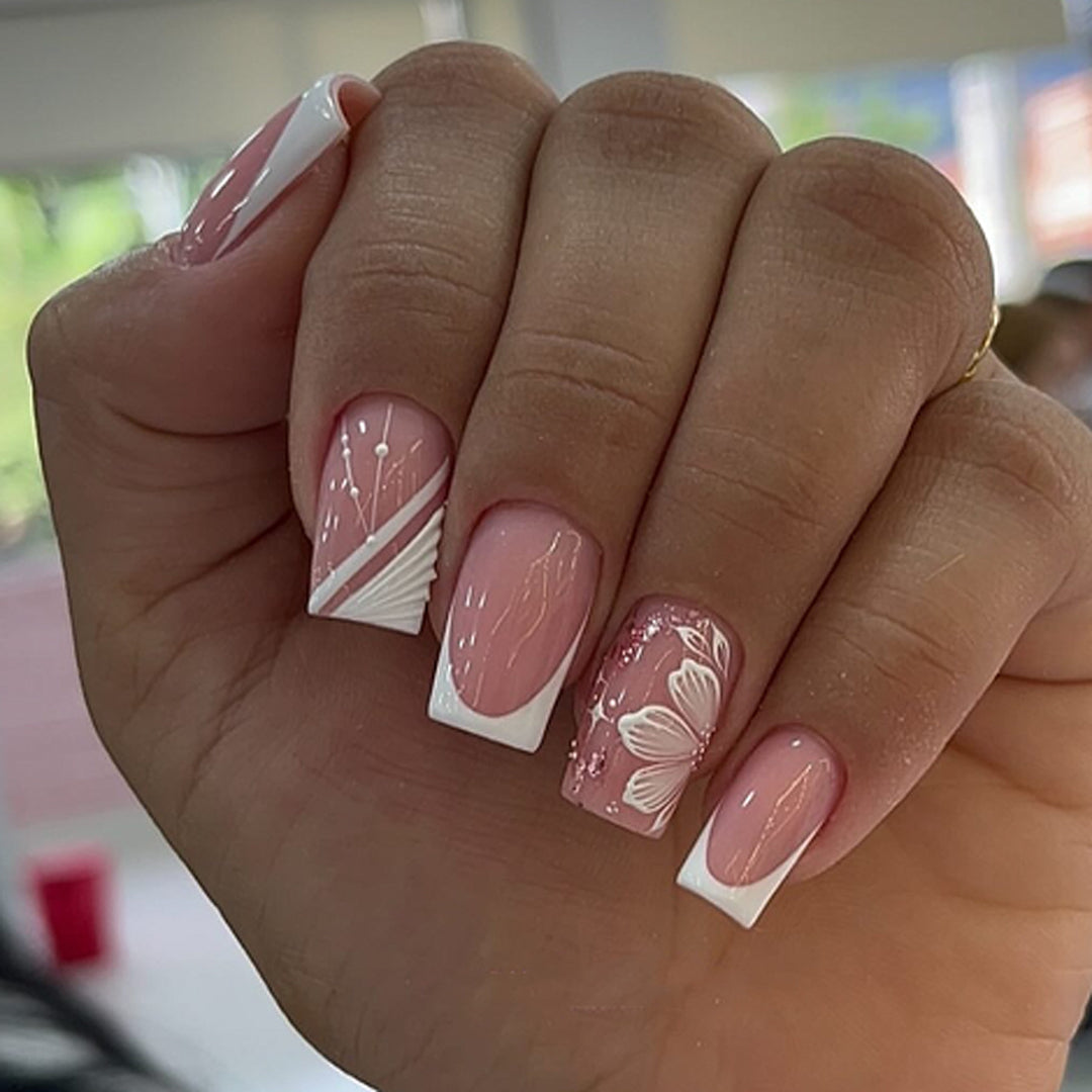 Artful Nail Art with Elegant French Tips and Floral Accents Kalsten