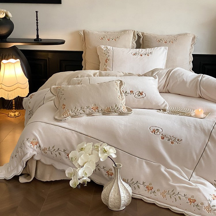High-quality embroidered bedding set made of cotton percale with ruffled hem and floral relief