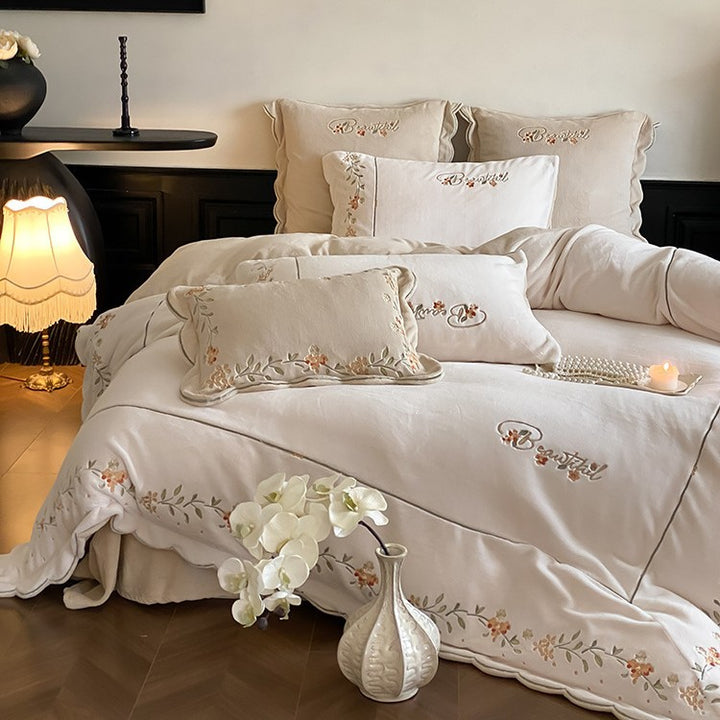 High-quality embroidered bedding set made of cotton percale with ruffled hem and floral relief