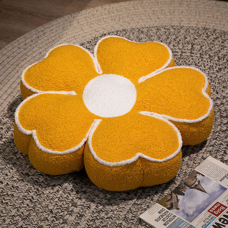 Padded seat cushion in flower shape with faux leather center piece and fluffy edge padding
