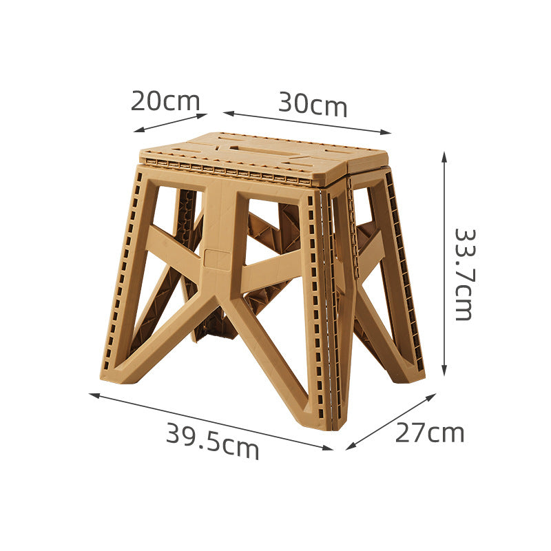 Compact foldable step stool made of shatterproof plastic with carrying handle and non-slip feet