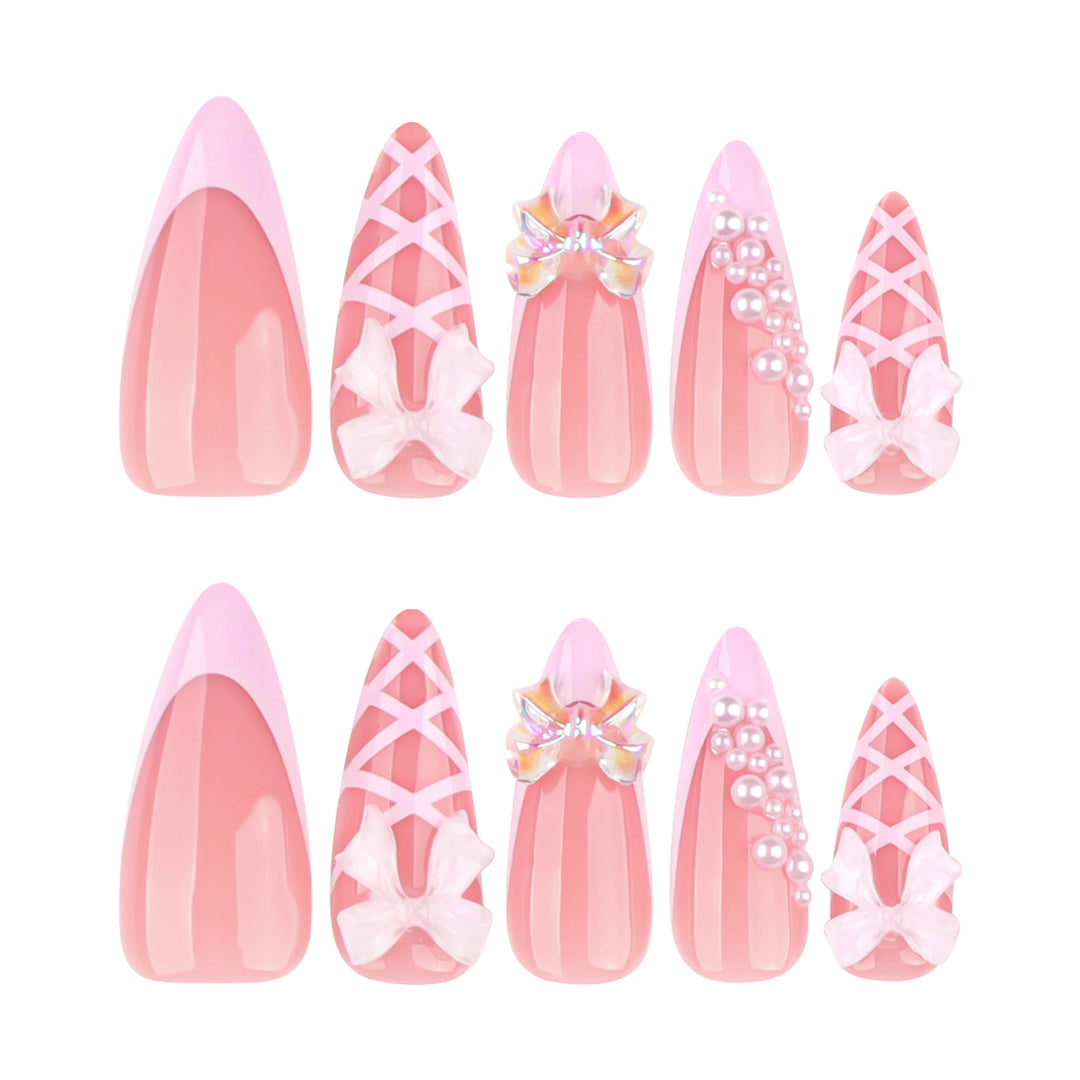Artful stiletto nails with glitter and bow decoration Kalsten