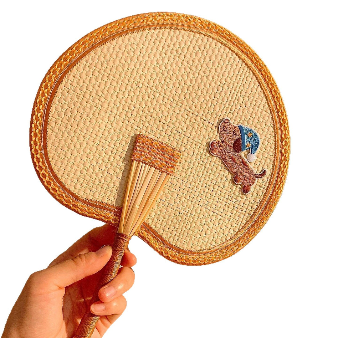 Handcrafted fan with playful dog motif Kalsten