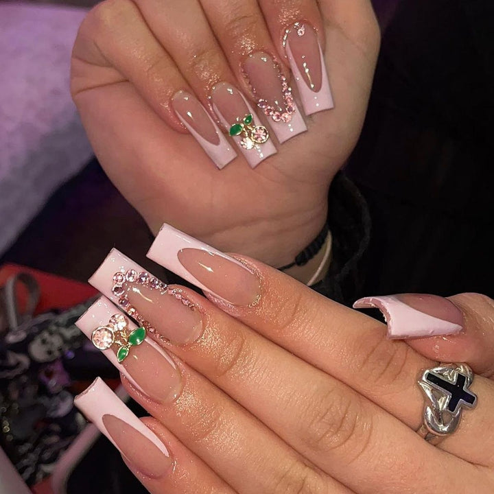Creative acrylic nail set with delicate pearl and gloss accents Kalsten