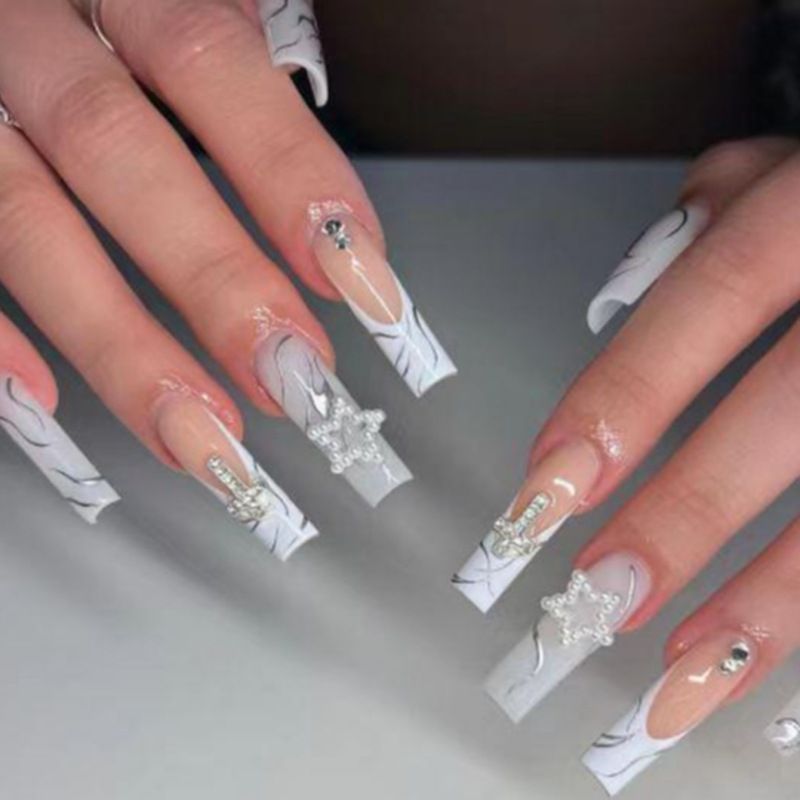 Artificial nails with luxurious marble design and radiant embellishments Kalsten