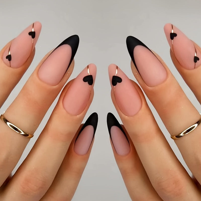 Creative nail art set with heart-shaped accents and elegant French tips Kalsten