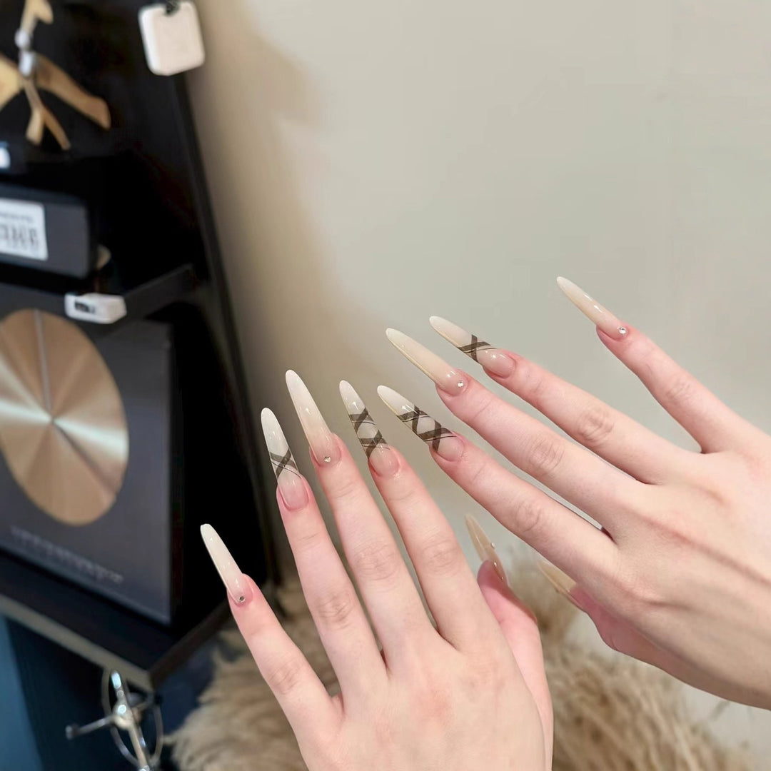 Elegant Stiletto Nail Enhancements with Artistic Accents