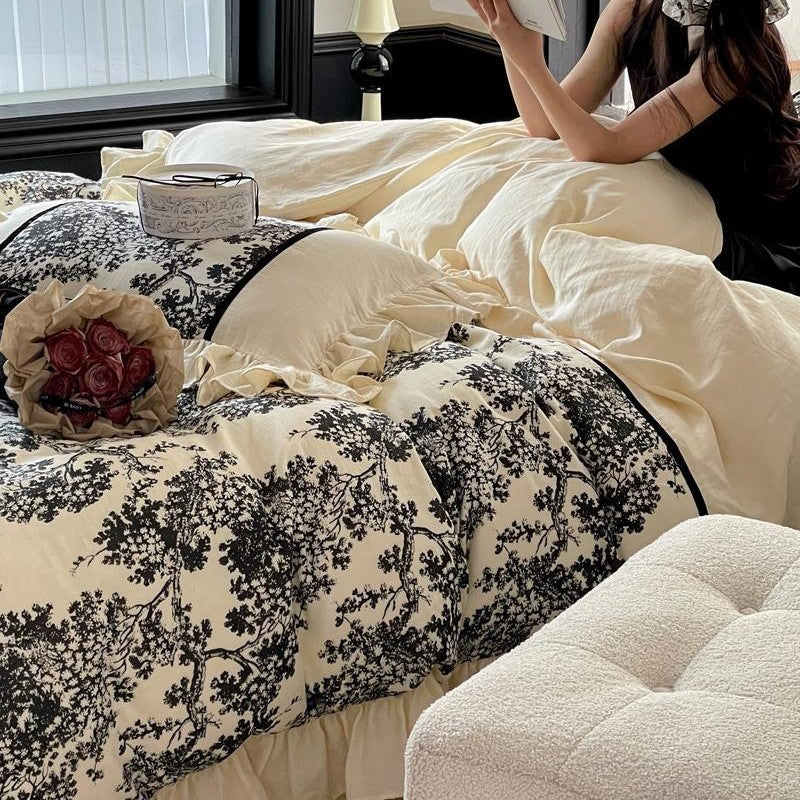 Romantic reversible bedding set made of fine cotton satin with ruffled flounces and toile design