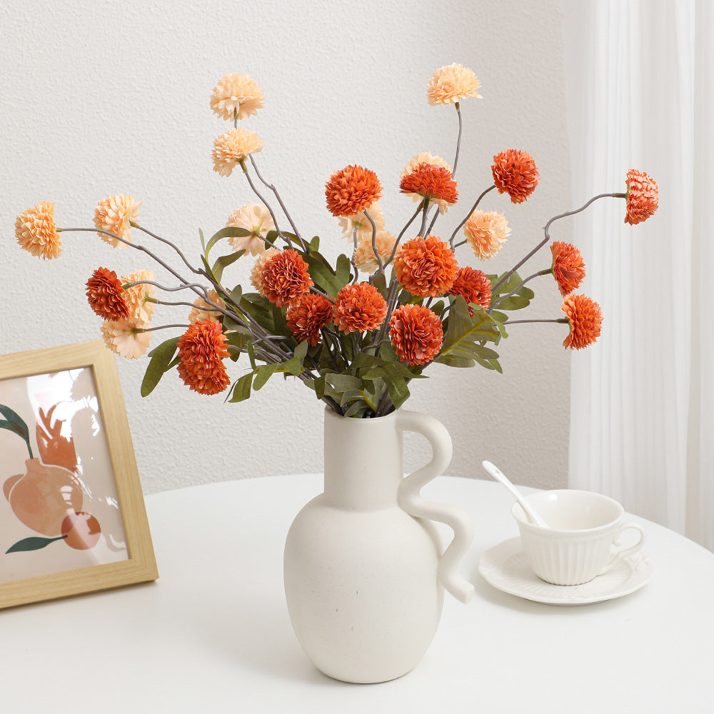 Artificial flower branch with intricate flowers