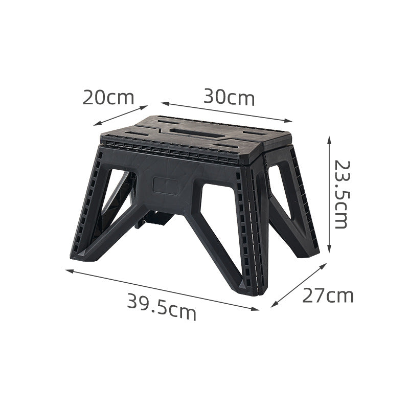 Compact foldable step stool made of shatterproof plastic with carrying handle and non-slip feet