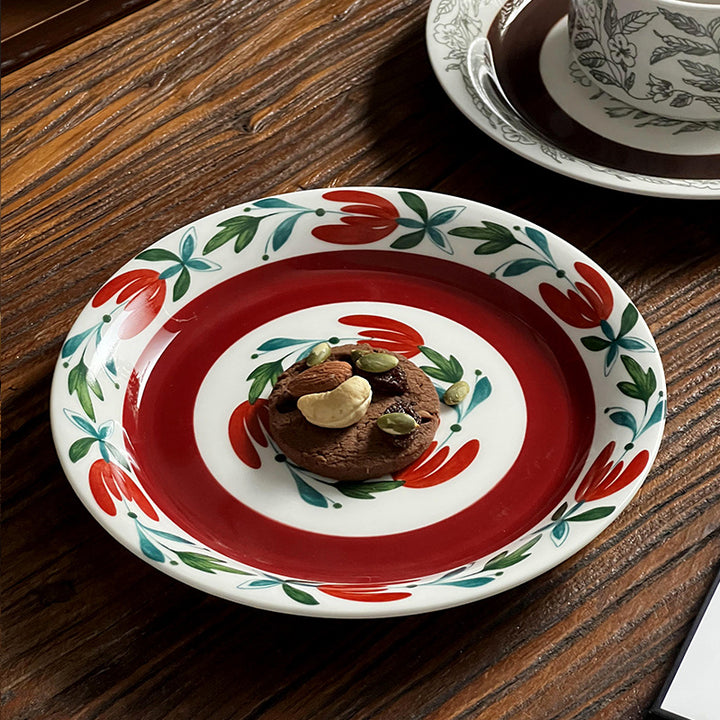 Deep porcelain plate with floral rim ornamentation and contrasting inner mirror