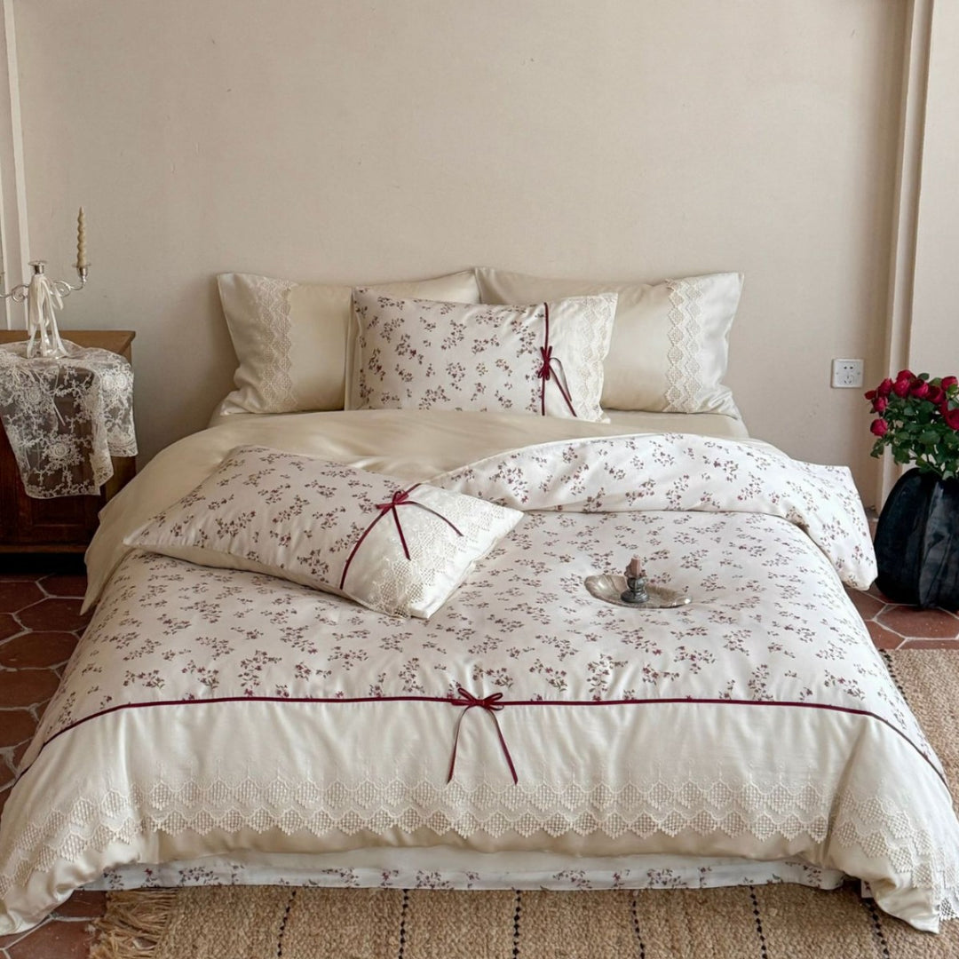 Luxurious cotton satin duvet cover set with lace trim, floral all-over embroidery, and decorative ribbons