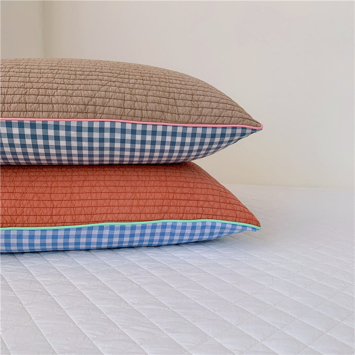 Reversible quilted pillow set with checked cotton cover and contrasting piping