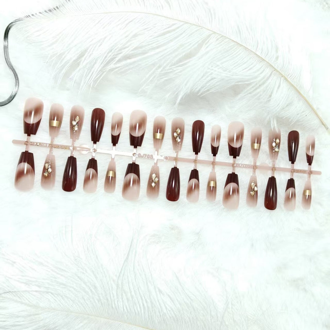Artificial nails with elegant color gradients and jewelry details Kalsten