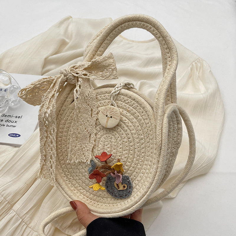 Handcrafted Floral Accent Straw Bag