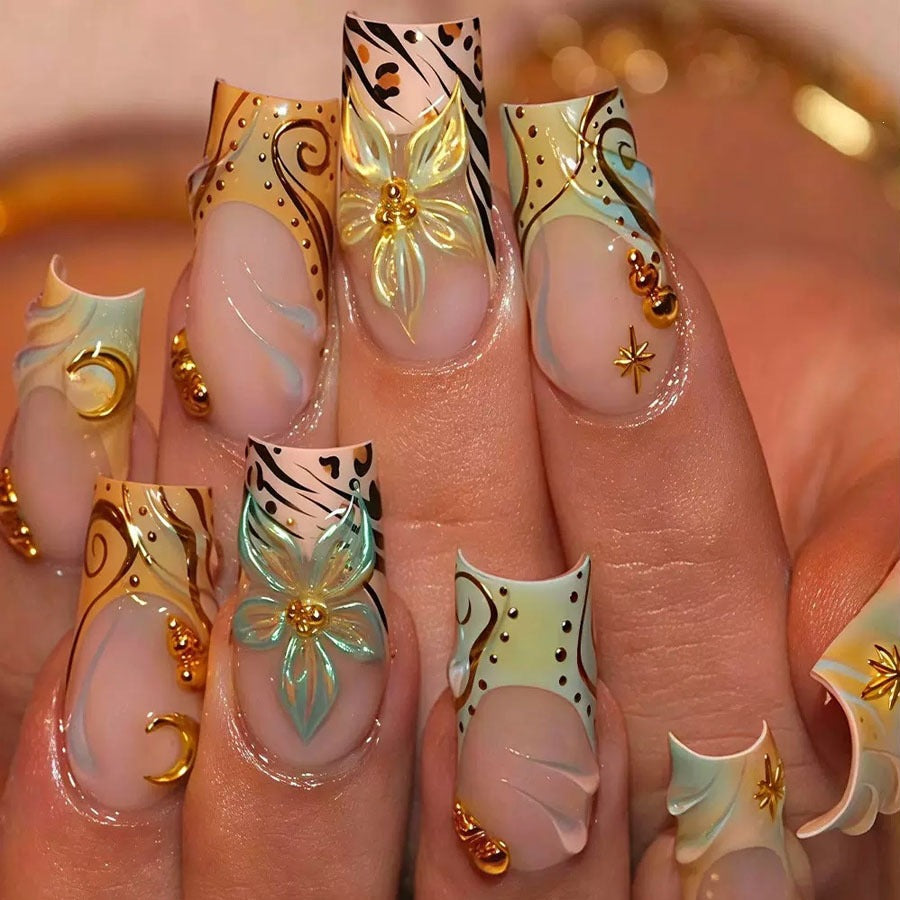 Luxurious artificial nail set with creative floral design and golden accents Kalsten