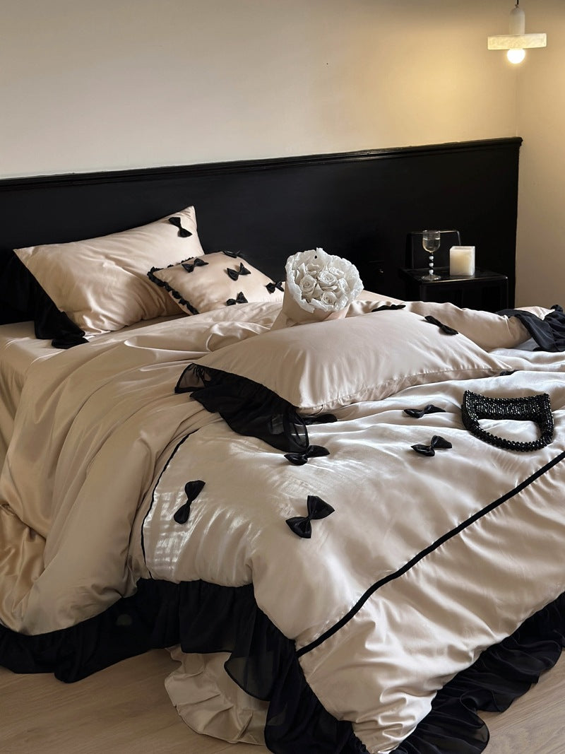Elegant bedding set made of cotton satin with attached bows and ruffles