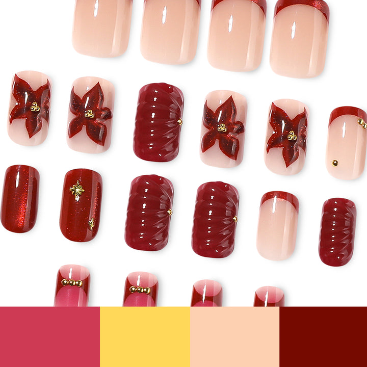 Artful nail design with floral and golden accents Kalsten