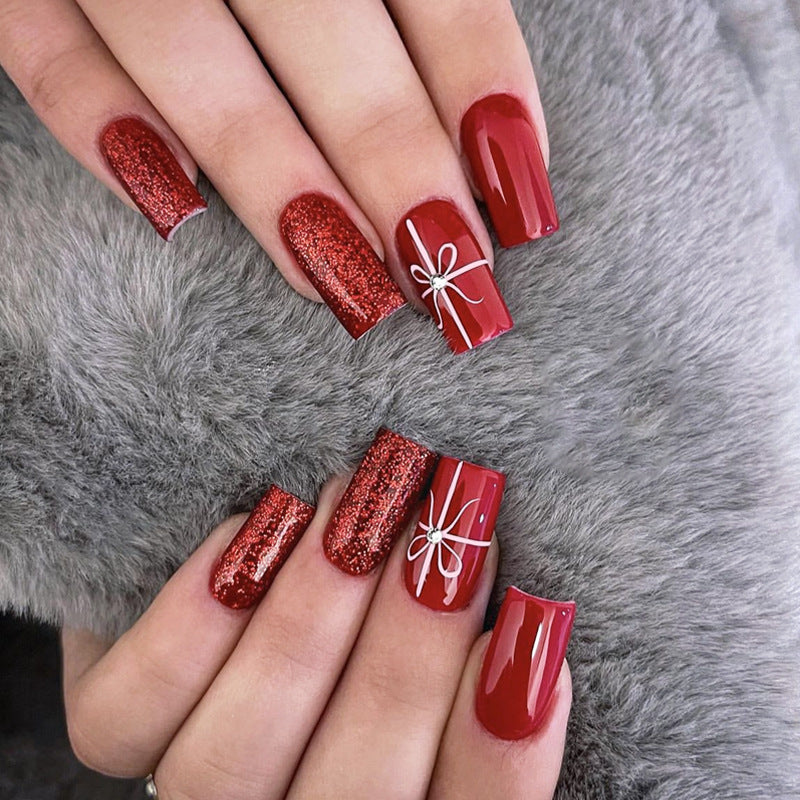 Creative acrylic nail set with glitter and bow designs Kalsten
