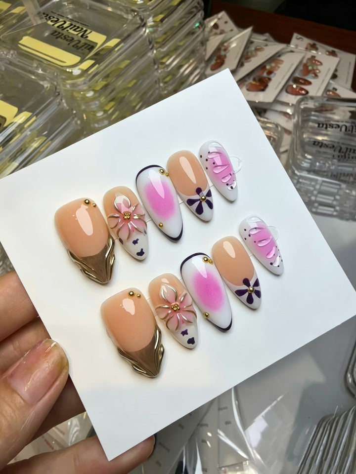Artistic Press-On Nail Set with Floral and Green Accents