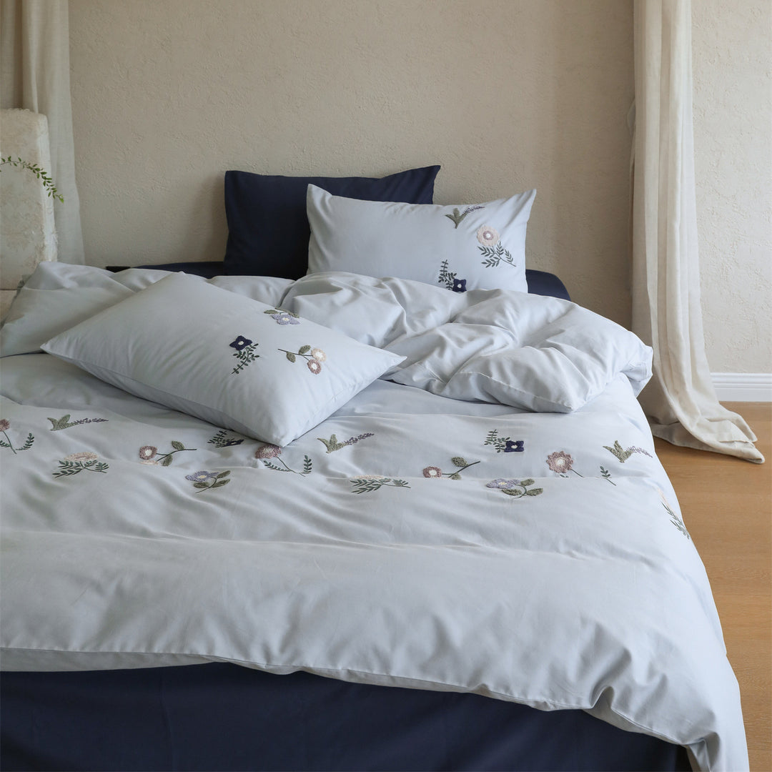 Embroidered cotton bedding set with delicate wildflower embroidery and percale texture