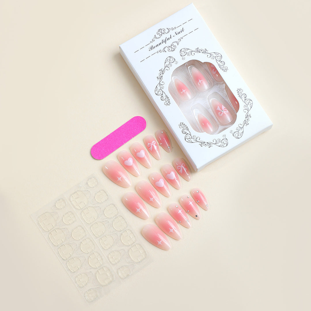 Acrylic nail set with romantic heart and bow design Kalsten