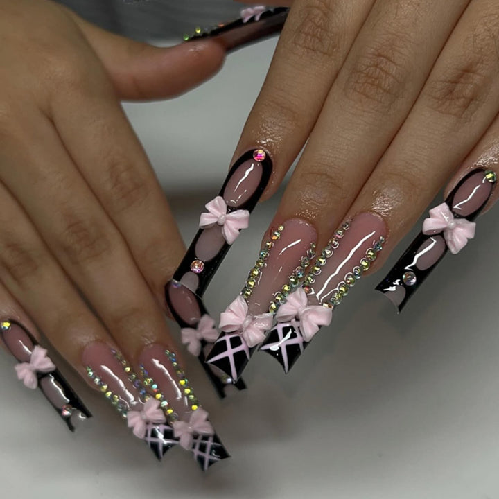 Artistic acrylic nails with floral design and rhinestone bow Kalsten