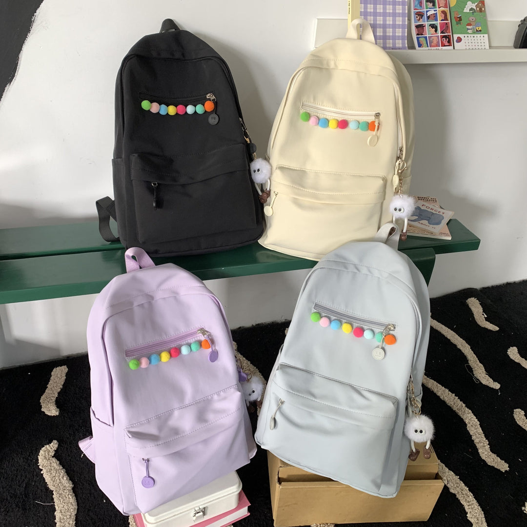 Practical backpack with colorful applications Kalsten