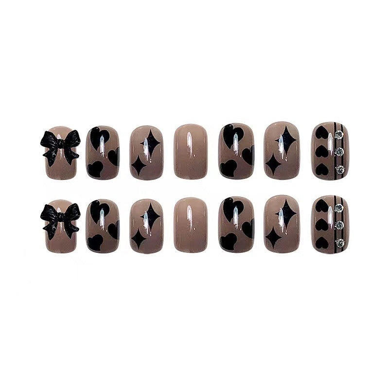 Artificial nails with elegant ribbon and heart designs Kalsten