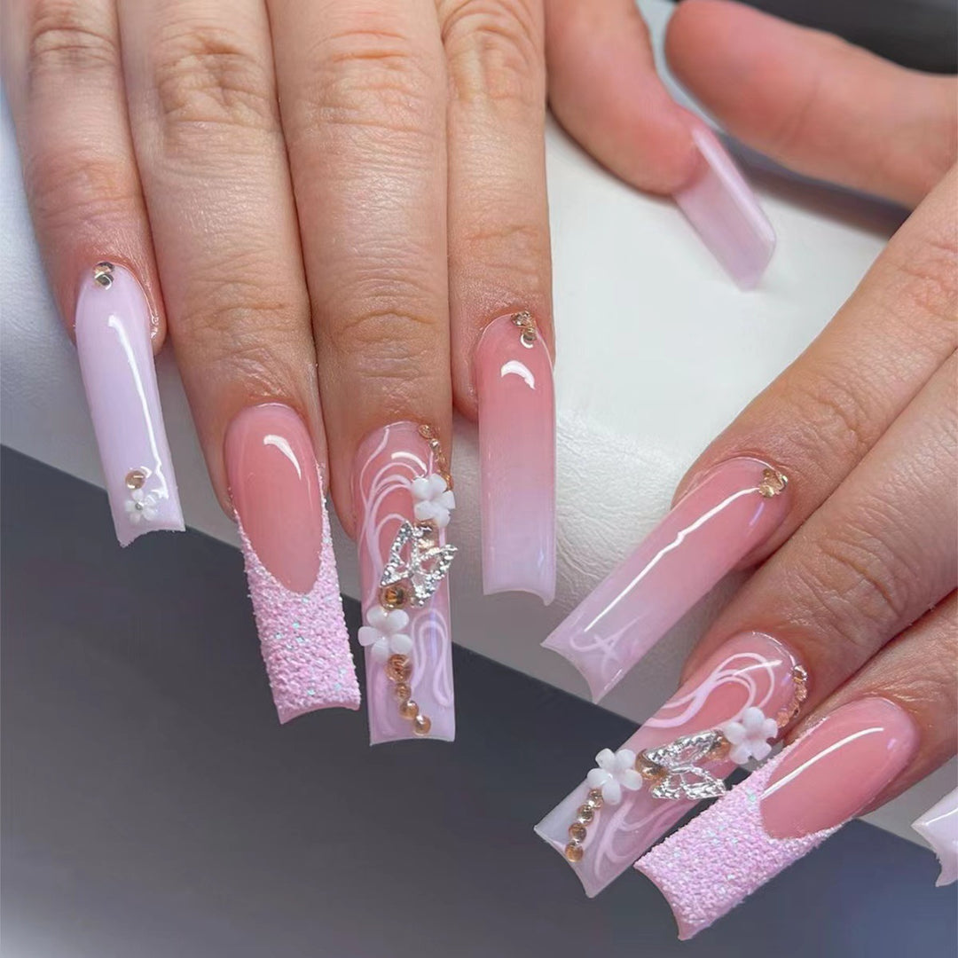 Elegant Long Acrylic Nail Extensions with Decorative Accents