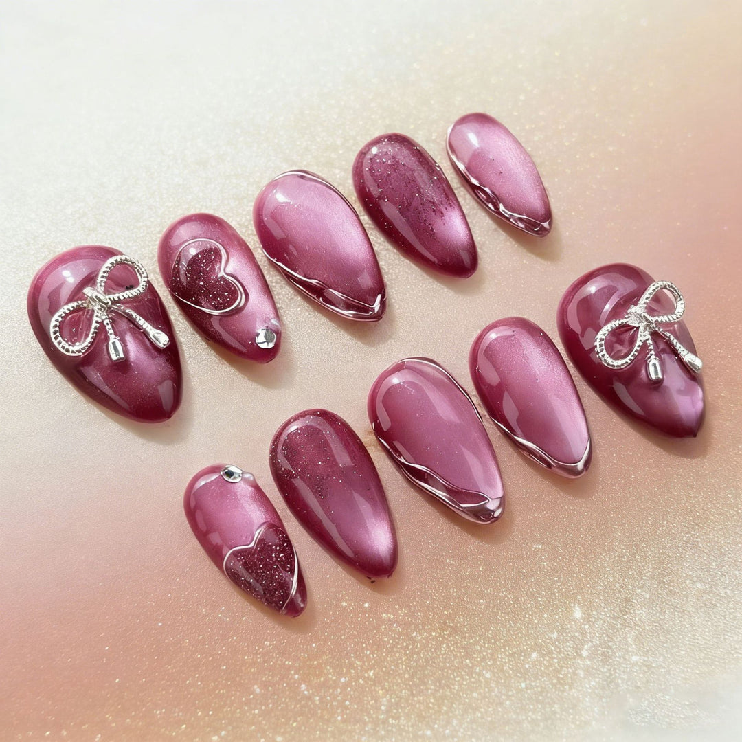 Acrylic nail set with elegant heart and bow decorations Kalsten