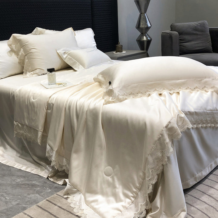 Elegant satin bedding set with lace trim and quilted bedspread
