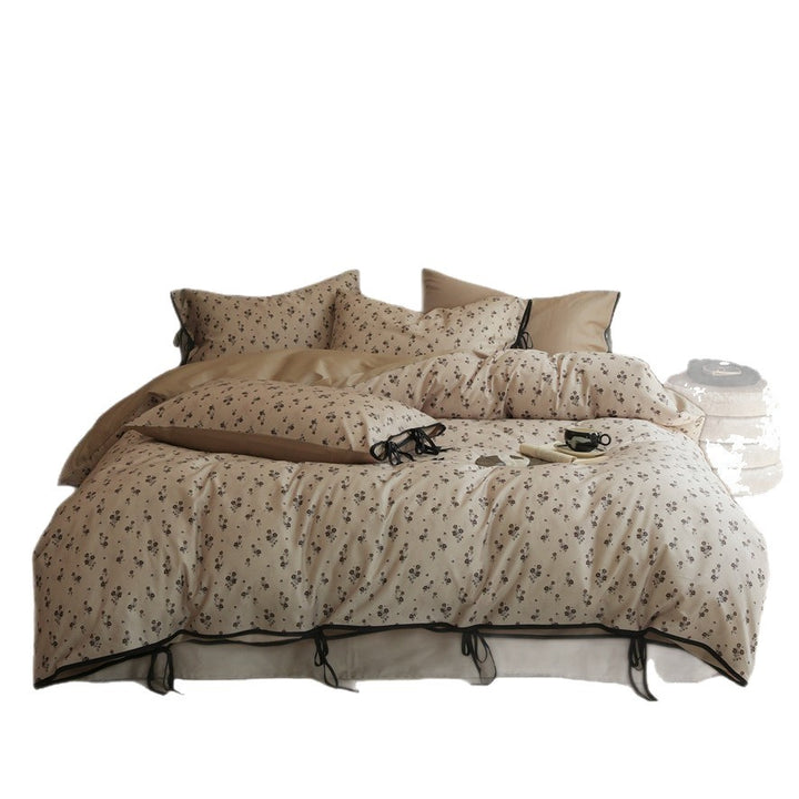 Bedding set made of cotton satin with fine floral microprint and decorative ribbons