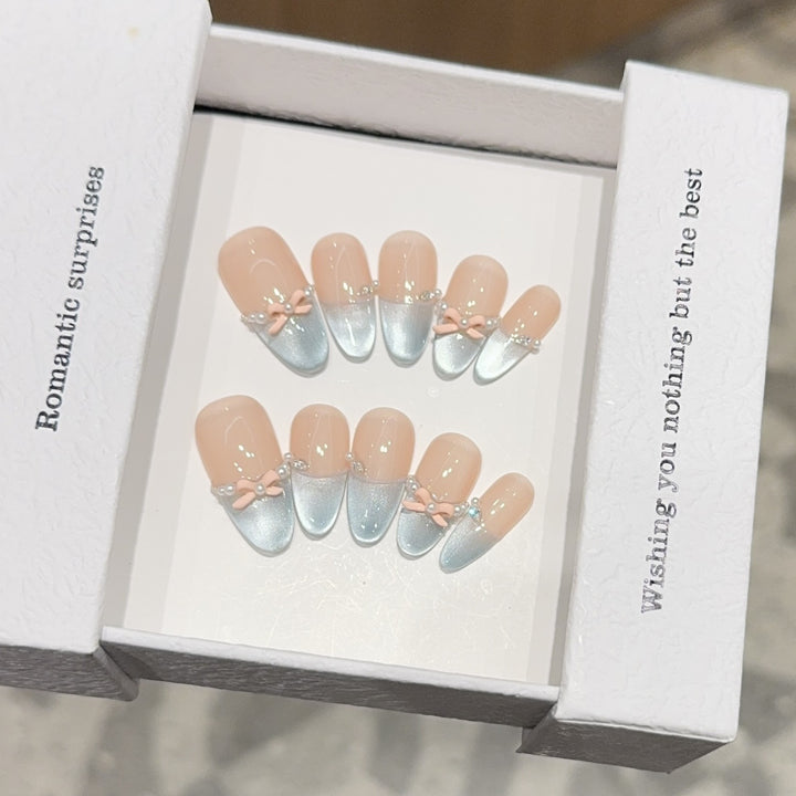 Artificial nail set with romantic bow and glitter accents Kalsten